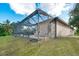 Screened-in pool enclosure with lush grass area at 12342 Lavender Loop, Bradenton, FL 34212