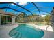 Inviting pool and spa with a screened enclosure, offering a private outdoor oasis at 12342 Lavender Loop, Bradenton, FL 34212