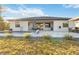 Modern home with pool, patio, and grassy backyard at 1256 Napoleon Rd, North Port, FL 34288
