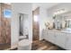 Spacious bathroom featuring dual vanities, walk-in shower, and stylish tile walls at 1256 Napoleon Rd, North Port, FL 34288