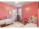 Vibrant pink bedroom with playful decor and two twin beds at 1256 Napoleon Rd, North Port, FL 34288