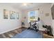 Home gym in bedroom with exercise bike, TV, and weights at 1256 Napoleon Rd, North Port, FL 34288