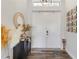 Welcoming entryway with decorative accents and wood-look flooring at 1256 Napoleon Rd, North Port, FL 34288