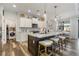 Modern kitchen with white shaker cabinets, an island with bar seating, and stainless steel appliances at 1256 Napoleon Rd, North Port, FL 34288