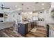 Kitchen with island, stainless steel appliances, and view of the living room at 1256 Napoleon Rd, North Port, FL 34288
