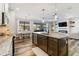 Open kitchen with an island, stainless steel appliances, and a view of the living room at 1256 Napoleon Rd, North Port, FL 34288