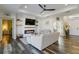 Cozy living room with a fireplace, large TV, and access to a bedroom at 1256 Napoleon Rd, North Port, FL 34288