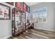 Home office with wood floors, large window, and sports memorabilia display at 1256 Napoleon Rd, North Port, FL 34288