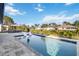 Backyard oasis with pool, lounge chairs, and lush landscaping at 1256 Napoleon Rd, North Port, FL 34288