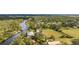 Aerial view showing a house on the river with surrounding landscape at 1285 & 1289 Hagle Park Rd, Bradenton, FL 34212