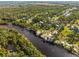 Aerial view of riverfront homes and lush landscape at 1285 & 1289 Hagle Park Rd, Bradenton, FL 34212