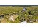 Aerial view of riverfront property with lush surroundings at 1285 & 1289 Hagle Park Rd, Bradenton, FL 34212
