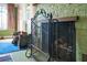 Fireplace with ornate screen and wood storage at 1285 & 1289 Hagle Park Rd, Bradenton, FL 34212