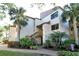 Building exterior showcasing landscaping and entrance at 1700 Cove Ii Pl # 311, Sarasota, FL 34242