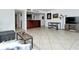 Open living space with tile floors and modern furniture at 1700 Cove Ii Pl # 311, Sarasota, FL 34242