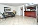 Living room features a comfortable couch and kitchen bar at 1700 Cove Ii Pl # 311, Sarasota, FL 34242