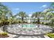 Relaxing community spa surrounded by lush landscaping and palm trees at 17942 Palmiste Dr, Bradenton, FL 34202