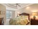 Bright bedroom with a king-size bed and private balcony access at 1901 Harbour Links Cir # 1, Longboat Key, FL 34228