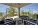 Outdoor patio area with seating and a hot tub, surrounded by lush greenery at 200 Garfield Dr, Sarasota, FL 34236