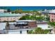 Spacious rooftop deck with glass railing, outdoor seating, and ocean views at 200 Garfield Dr, Sarasota, FL 34236