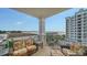 Large balcony with comfortable seating and coastal views at 2050 Benjamin Franklin Dr # B603, Sarasota, FL 34236