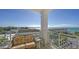 Relaxing balcony with wicker seating overlooking the beach at 2050 Benjamin Franklin Dr # B603, Sarasota, FL 34236