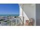 Relaxing balcony with wicker chair and breathtaking ocean views at 2050 Benjamin Franklin Dr # B603, Sarasota, FL 34236