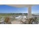 Relaxing balcony with lounge chairs and scenic coastal views at 2050 Benjamin Franklin Dr # B603, Sarasota, FL 34236
