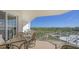 Balcony with patio furniture, perfect for outdoor dining at 2050 Benjamin Franklin Dr # B603, Sarasota, FL 34236