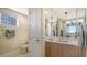 Guest bathroom with single vanity, toilet, and tiled floor at 2050 Benjamin Franklin Dr # B603, Sarasota, FL 34236