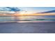 Peaceful beach at sunset with calm waves and soft sand at 2050 Benjamin Franklin Dr # B603, Sarasota, FL 34236