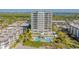 Modern condo building with pool, surrounded by lush landscaping at 2050 Benjamin Franklin Dr # B603, Sarasota, FL 34236