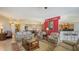 Spacious living room with leather furniture, a dining area, and an open kitchen at 2050 Benjamin Franklin Dr # B603, Sarasota, FL 34236