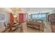 Open concept living and dining area with elegant furnishings at 2050 Benjamin Franklin Dr # B603, Sarasota, FL 34236