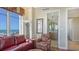 Cozy living room with plush seating, ocean views, and nearby bathroom at 2050 Benjamin Franklin Dr # B603, Sarasota, FL 34236