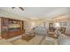 Living area with leather furniture, and access to a dining space at 2050 Benjamin Franklin Dr # B603, Sarasota, FL 34236