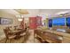 Open concept living and dining area with floor-to-ceiling windows showcasing city views at 2050 Benjamin Franklin Dr # B603, Sarasota, FL 34236