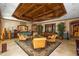 Hotel-style lobby with wicker furniture, coffered ceilings, and ornate decor at 2050 Benjamin Franklin Dr # B603, Sarasota, FL 34236