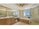 Luxurious Primary bathroom featuring a soaking tub, large shower, and dual vanities at 2050 Benjamin Franklin Dr # B603, Sarasota, FL 34236