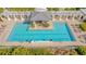 Inviting community pool with covered pergola and ample seating at 2050 Benjamin Franklin Dr # B603, Sarasota, FL 34236