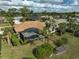 Aerial view of house, pool, and surrounding landscape at 2112 Calusa Lakes Blvd, Nokomis, FL 34275