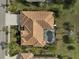 Bird's-eye view of single-Gathering home with pool and lush landscaping at 2112 Calusa Lakes Blvd, Nokomis, FL 34275