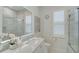 Clean bathroom with a large mirror, shower, and white vanity at 2112 Calusa Lakes Blvd, Nokomis, FL 34275