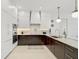 Modern kitchen with stainless steel appliances and dark wood cabinetry at 2112 Calusa Lakes Blvd, Nokomis, FL 34275