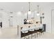 Modern kitchen with white and dark wood cabinets and a large island at 2112 Calusa Lakes Blvd, Nokomis, FL 34275