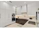 Modern kitchen with stainless steel appliances and dark wood cabinetry at 2112 Calusa Lakes Blvd, Nokomis, FL 34275