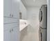 Bright laundry room with ample storage and modern appliances at 2112 Calusa Lakes Blvd, Nokomis, FL 34275