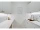 Laundry room with white cabinets, a copper sink and modern washer/dryer at 2112 Calusa Lakes Blvd, Nokomis, FL 34275