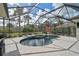 Screened pool and spa with a covered patio at 2112 Calusa Lakes Blvd, Nokomis, FL 34275