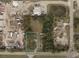 Aerial view of a commercial lot bordered by trees at 3219 63Rd E Ave, Bradenton, FL 34203